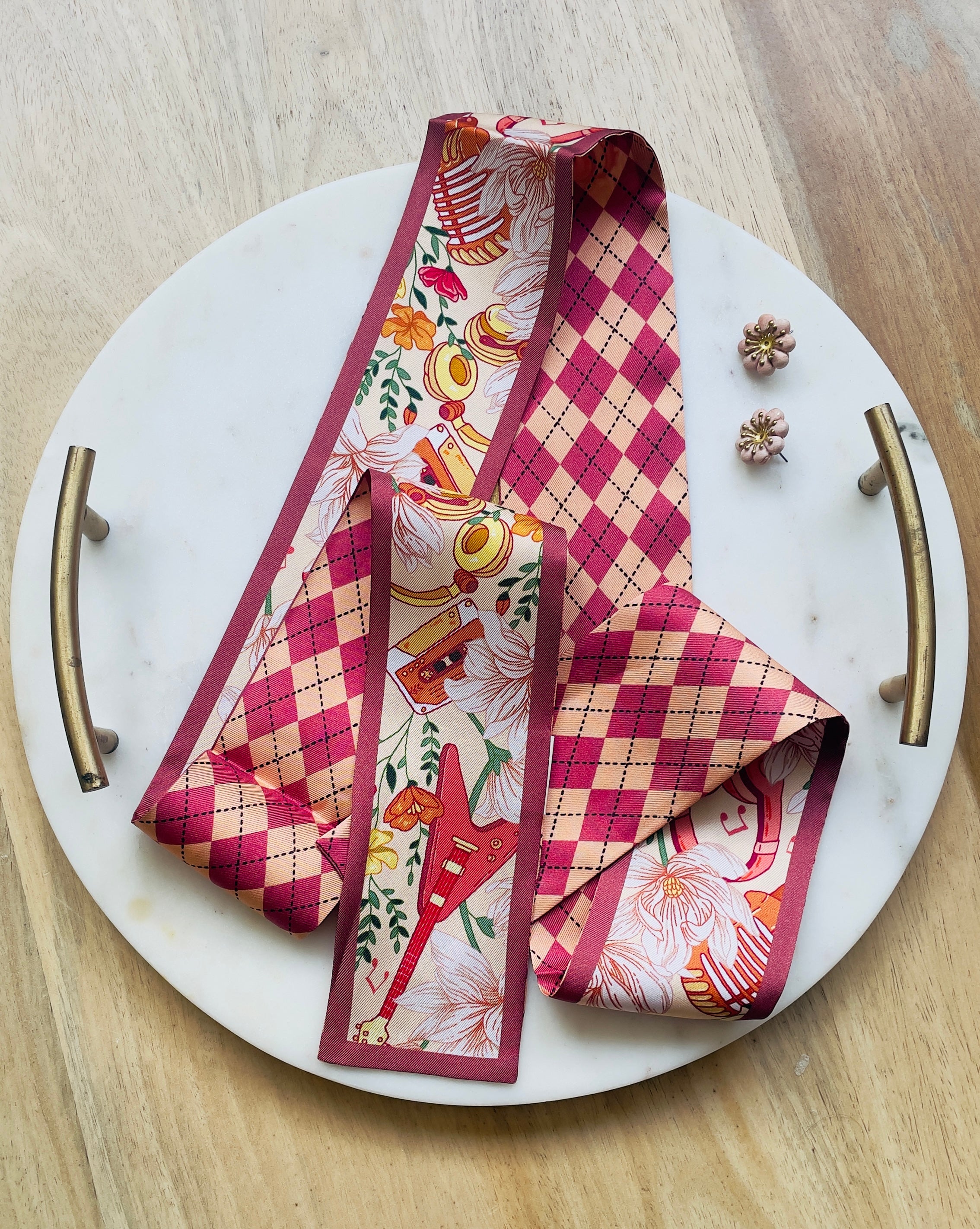 Melody Muse Silk Twilly Scarf with floral, argyle, and guitar motifs