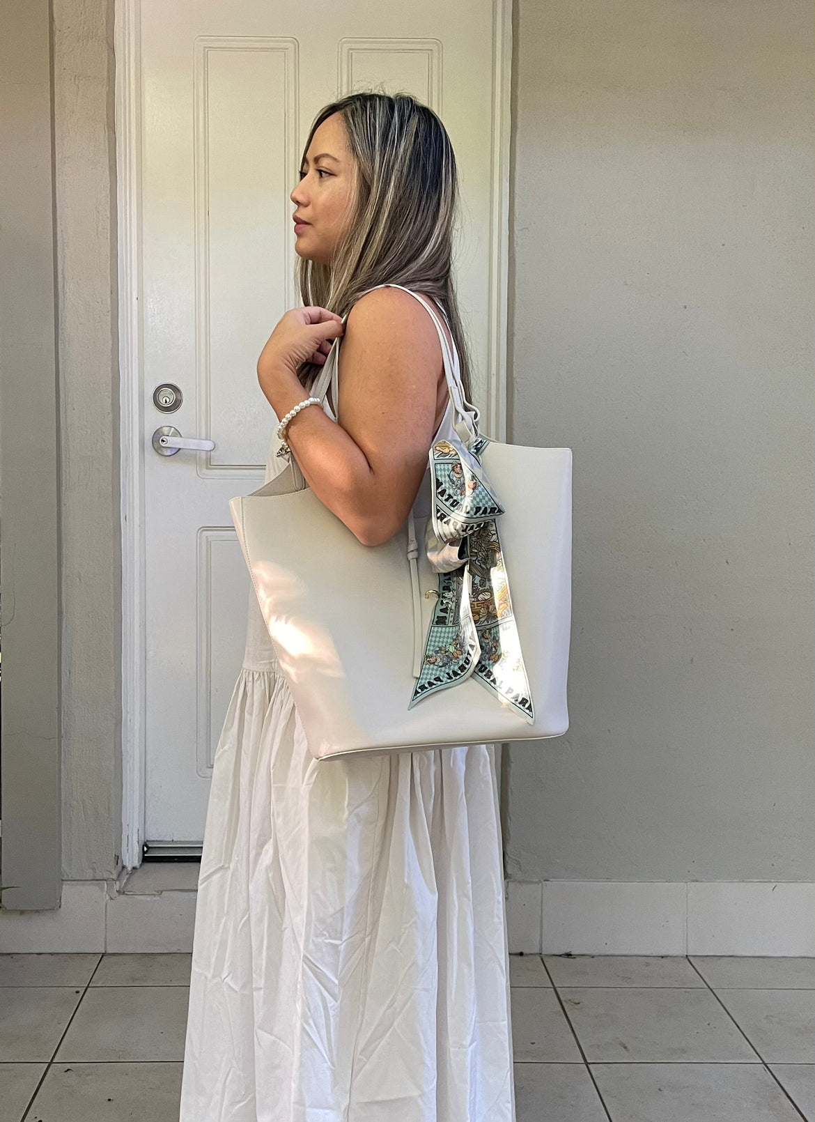 How to wear a silk scarf — Enchanted Trail Twilly tied around a handbag handle