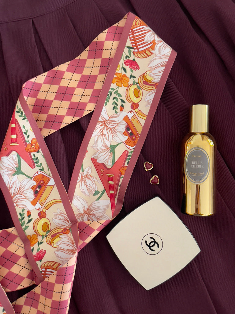 Melody Muse Silk Twilly Scarf with floral, argyle, and guitar motifs